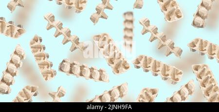 An egg packaging made of recycled cardboard on a blue background. An egg carton for recycling flies and floats in the air. Concept Stock Photo