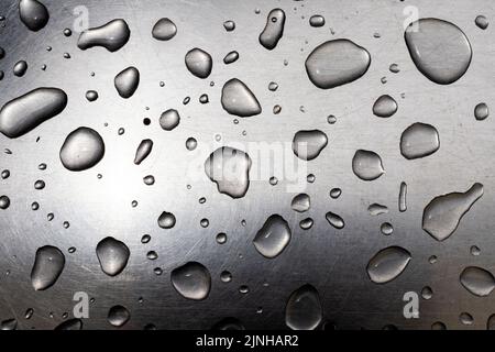 drops of water on a brushed steel surface Stock Photo