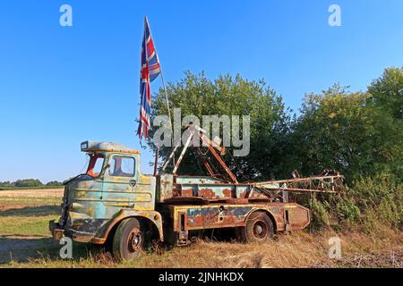 Decaying old Foden truck in Heath Lane, Northwich, Cheshire, England, UK, CW8 4RH, with Union flag Stock Photo