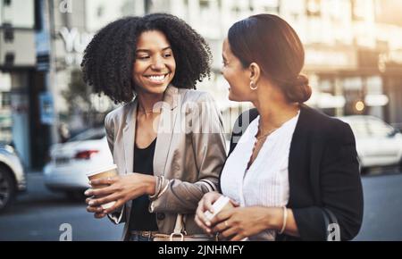 I cant wait to get started on making this day a success. two businesswomen walking in the city. Stock Photo