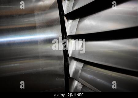 Powerful steam turbine shaft with installed long blades Stock Photo