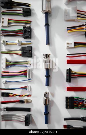 Pattern with different types plugs and connectors on white Stock Photo