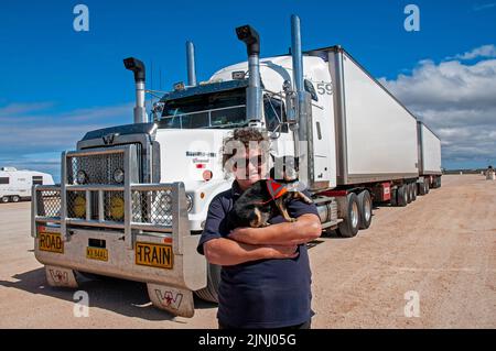 Woman truck driver, Faye Francis-Lewis, with her B Double truck in which she hauls 75 tonnes of tomatoes twice a week between Perth and Adelaide, covering a distance in excess of 10,000 km. Stock Photo