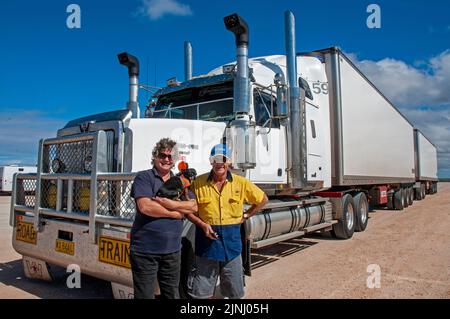 Woman truck driver, Faye Francis-Lewis, with her B Double truck in which she hauls 75 tonnes of tomatoes twice a week between Perth and Adelaide, covering a distance in excess of 10,000 km. Stock Photo