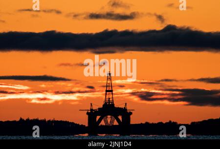 File photo dated 27/04/20 of the sun rising behind a redundant oil platform moored in the Firth of Forth near Kirkcaldy, Fife, as an oil and gas body has urged the candidates in the running to become prime minister to scrap the windfall tax on profits as soon as possible. Stock Photo