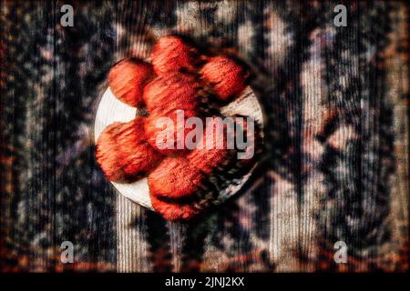 Original Black Forest Bollen hat in front of wooden wall in surrealistic style Stock Photo