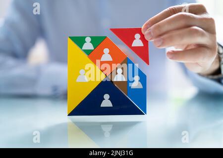 HR Recruitment Hand Making Tangram Puzzle. Talent Management Stock Photo