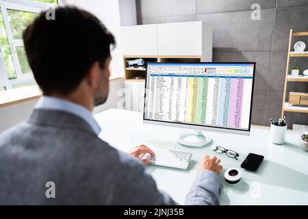 Electronic Spreadsheet On Analyst Auditor Computer Screen Stock Photo