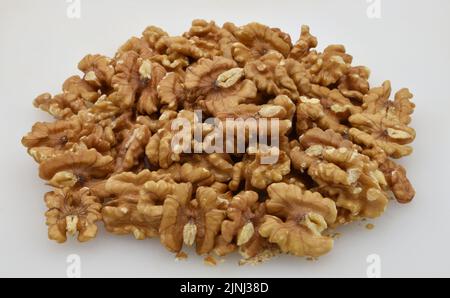 Pile of walnuts isolated on white background. Stock Photo