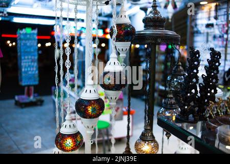 Traditional handmade multicolor Turkish, Moroccan, Arabian lamps. Mosaic style and colored glass lantern. Turkish lamps in souvenir shop in Turkey Stock Photo
