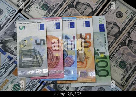 Pictures of the currencies of the euro against the dollar. The value of the euro fell against the US dollar for the first time in years Stock Photo