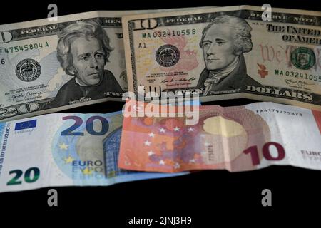 Pictures of the currencies of the euro against the dollar. The value of the euro fell against the US dollar for the first time in years Stock Photo