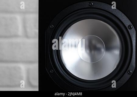 Shiny classic audio speaker in black body, close-up photo with selective soft focus Stock Photo