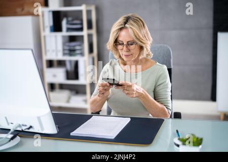 Taking Document Picture Or Photo With Phone. Smartphone Optical Document Stock Photo