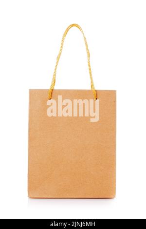 Blank shopping paper bags mockup. Empty cardboard craft bag on a white background. Consumer pack ready for logo design. Shopping and gifts concept. Stock Photo