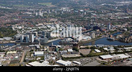 Aerial view of Salford looking north east from MediaCity towards the University of Salford. Wharfside Way (A5081 road) runs along the image front edge Stock Photo