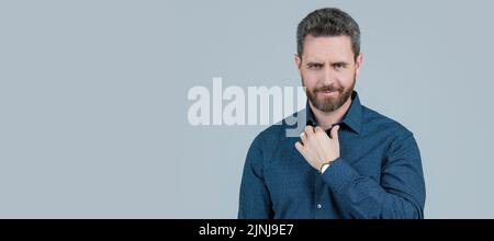 Casual appearance without having to don a tie. Bearded man wear shirt. Wearing smart casual. Man face portrait, banner with copy space. Stock Photo