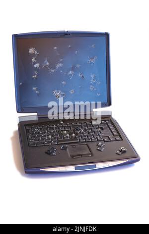 Broken screen and keyboard laptop isolated on white. Damaged device Stock Photo