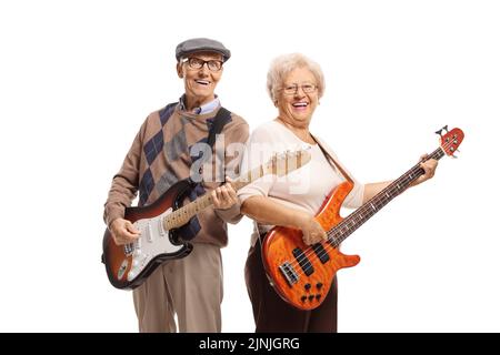 Elderly man and woman playing electric guitars and smiling isolated on white background Stock Photo