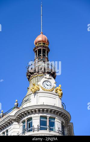 Architecture of the Four Seasons Hotel And Private Residences. Close-up to the clock tower. Stock Photo
