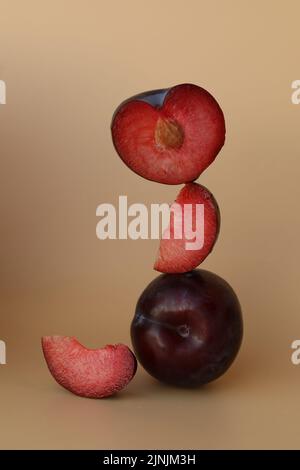 plums on the yellow background with copy space Stock Photo