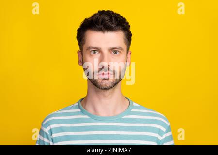 Closep photo of young handsome guy look concentrated you expert programmer isolated on yellow color background Stock Photo