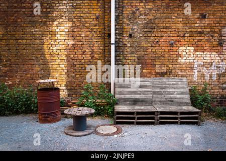 Nice contract of a bench in an industrial environment Stock Photo