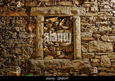 Stone background and bricked up window at night. Stock Photo