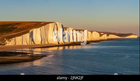 A panoramic photograph of the Seven Sisters cliffs in Sussex, at sunset Stock Photo