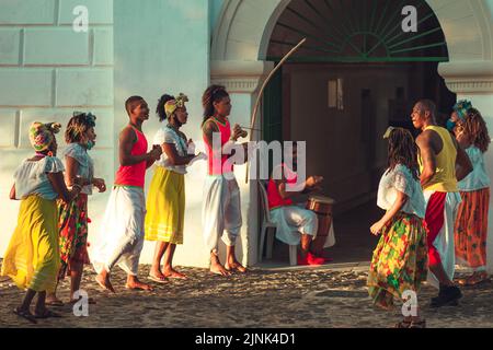 A view of Bahia people in colorful clothing gathering outdoors in Salvador, Brazil Stock Photo