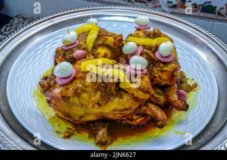 Moroccan chicken with quail eggs. And lemon. Served as a main dish at weddings Stock Photo