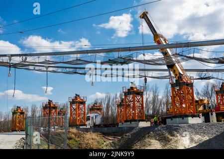Crane on construction site working Stock Photo