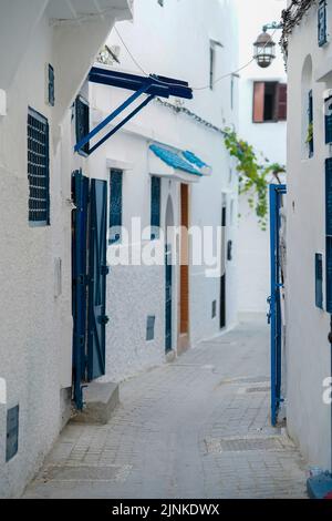 Blue doors on the front of house in Tangier Morocco Stock Photo