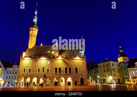 Tallinn Town Hall Square illuminated at night after raining. Stock Photo