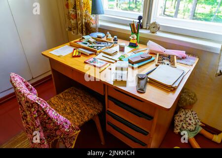 Children's desk to study with very old materials and utensils from bygone eras. Stock Photo
