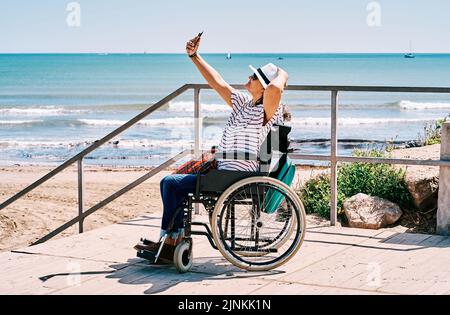 woman, disabled, wheelchair, selfie, female, ladies, lady, women, disableds, wheelchairs Stock Photo