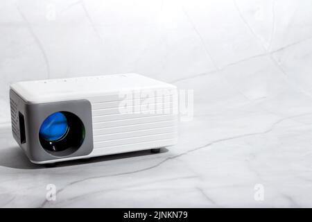 mini projector for house on marble surface Stock Photo