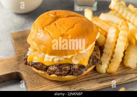 Homemade Wisconsin Butter Burger with Cheese and Fries Stock Photo