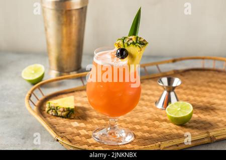 Boozy Cold Rum Runner Cocktail with Cherry and PIneapple Stock Photo