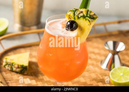 Boozy Cold Rum Runner Cocktail with Cherry and PIneapple Stock Photo