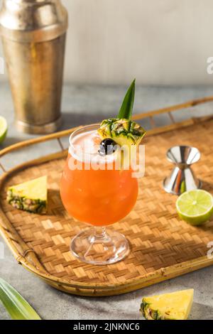 Boozy Cold Rum Runner Cocktail with Cherry and PIneapple Stock Photo