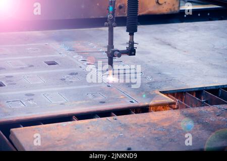 Laser cutting through hard material Stock Photo
