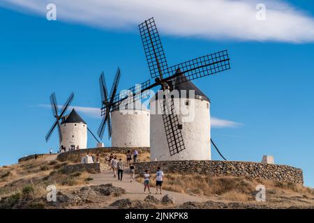 Consuegra, SPAIN - June 25 2022: Windmills from Consuegra Village, visited by hundreds of people every day. The story of Don Quixote starts from this Stock Photo