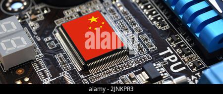 China flag on a processor, central processing unit CPU or microchip on a motherboard. Concept for the battle of global microchips production between C Stock Photo