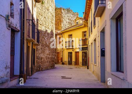 Picturesque alley of old houses next to the wall of Buitrago Lozoya, Madrid. Stock Photo