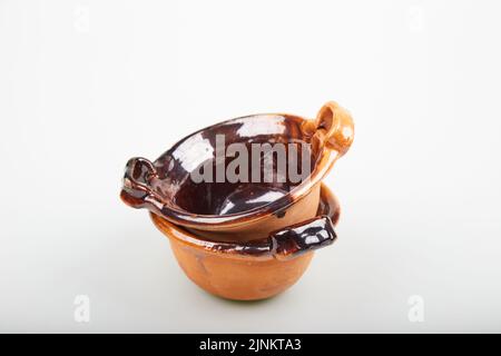 Ceramic clay pots (cassoles) isolated on white background Stock Photo