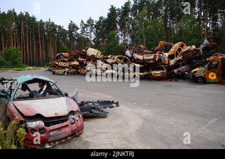 IRPIN, UKRAINE - AUGUST 11, 2022 - Sunflowers painted by artists are seen on the cars shot by the Russians during Russia's full-scale invasion of Ukra Stock Photo