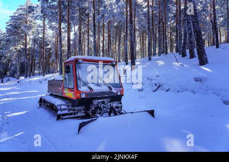 Snow-covered snowplow on the snowy forest path. Guadarrama Madrid. Stock Photo
