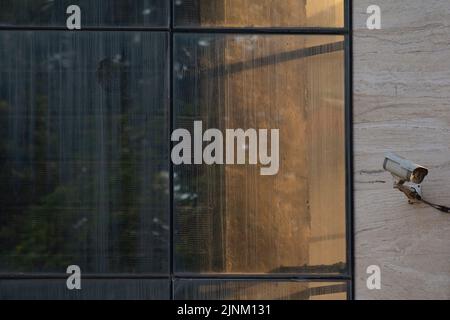 Security CCTV camera or surveillance system in office building, Intelligent cameras can record video all day and night to keep you safe from thieves Stock Photo
