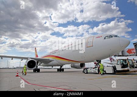 Brandenburg, Germany. 12th Aug, 2022. 12 August 2022, Brandenburg, Schönefeld: An Airbus A330-300 aircraft of Chinese carrier Hainan Airlines is readied for takeoff before its maiden flight at Berlin Brandenburg Airport. Photo: Wolfgang Kumm/dpa Credit: dpa picture alliance/Alamy Live News Stock Photo